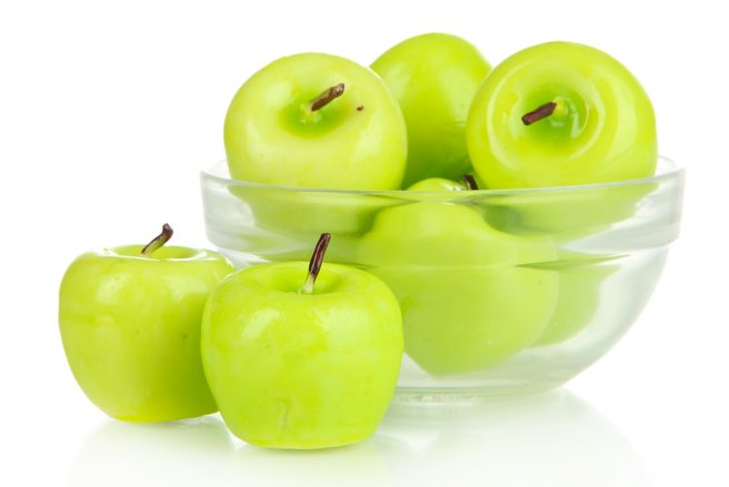 Ces objets ressemblent à des pommes, et pourtant, ce sont des bougies. © Shutterstock